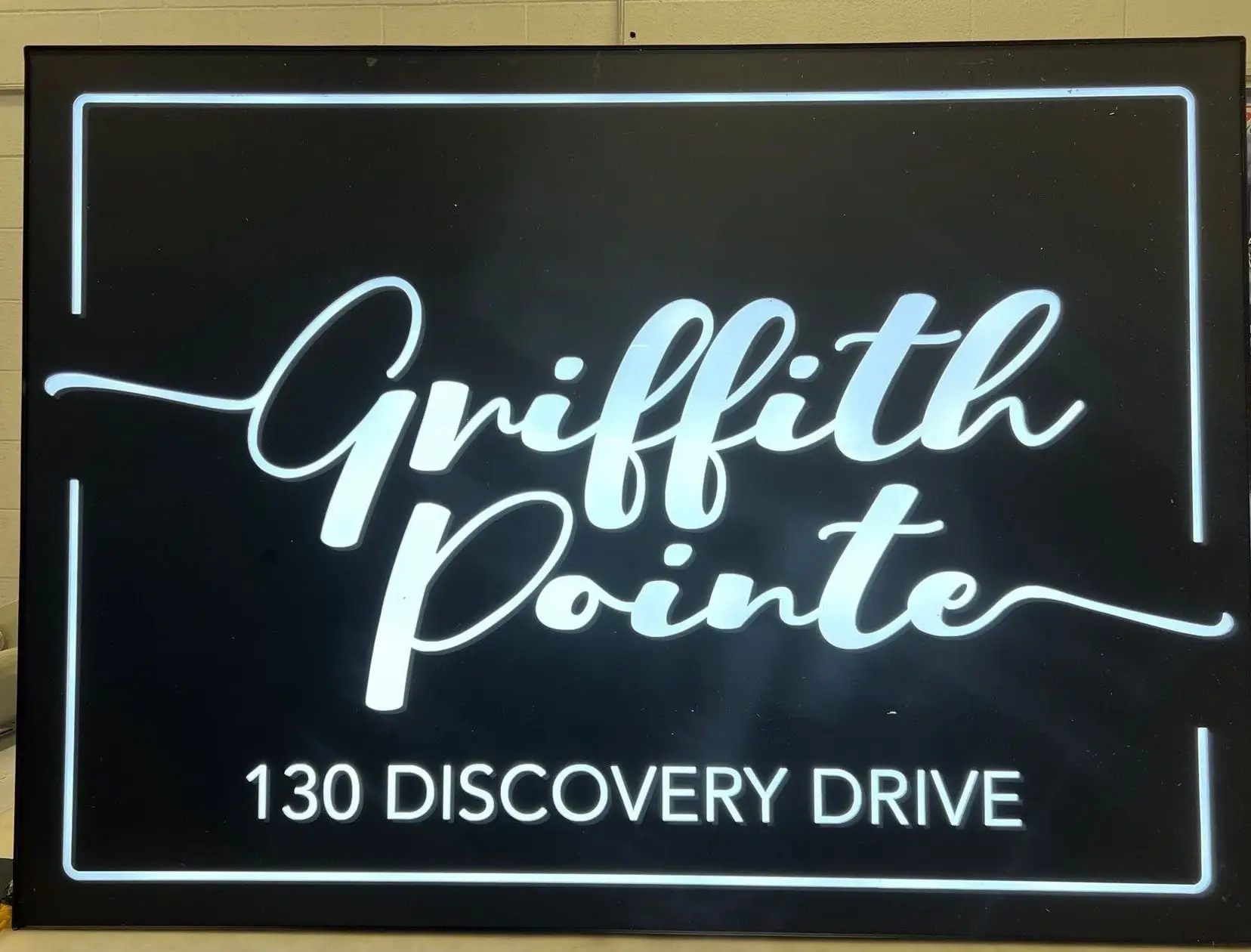 An illuminated push-through monument sign for a Calgary business park entrance